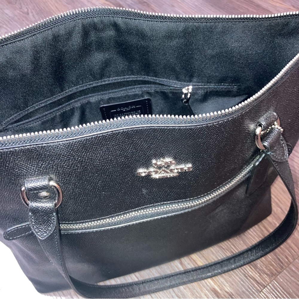 Leather black Coach tote that makes a perfect fashionable laptop bag